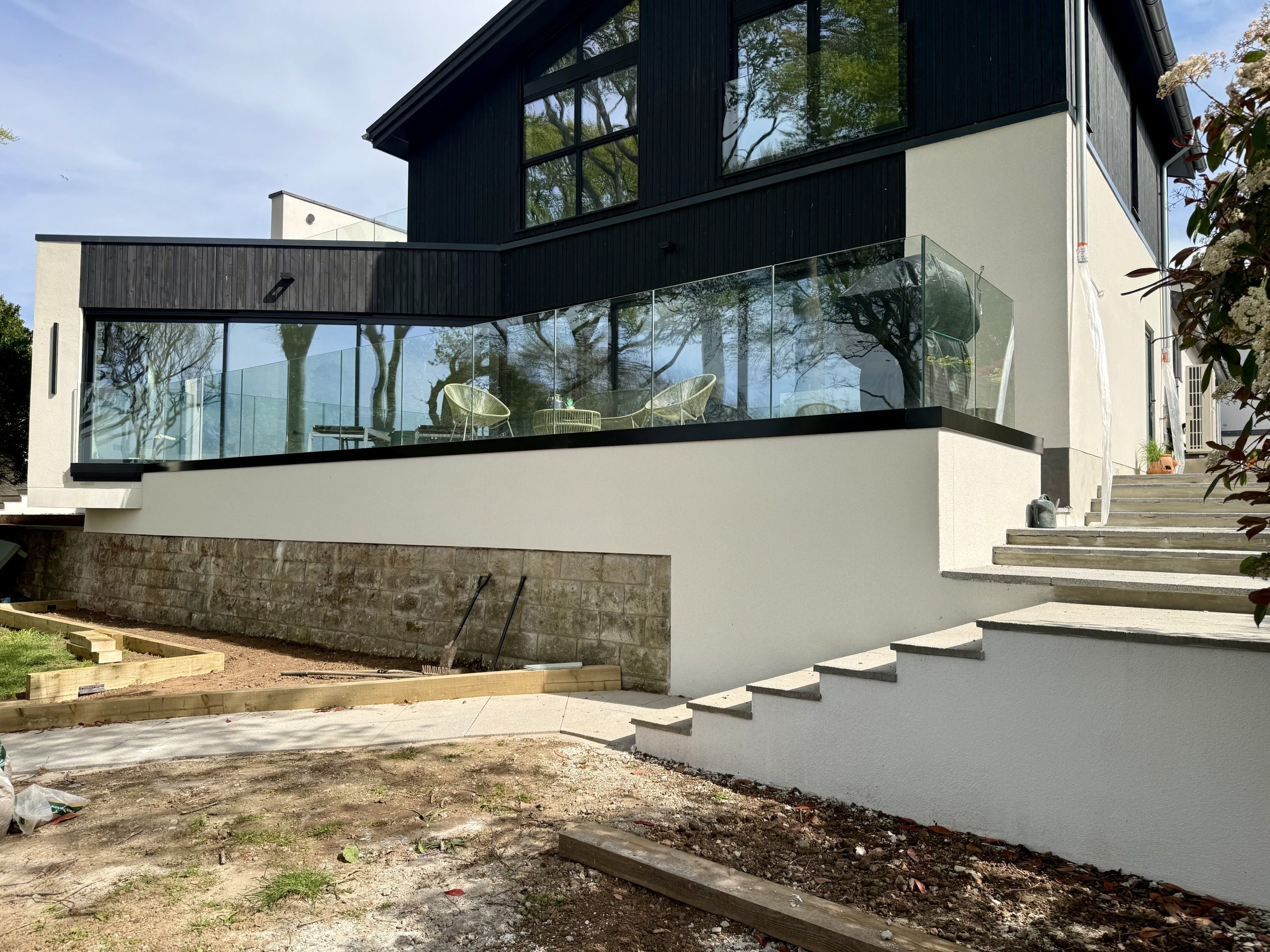 New steps, retaining wall and glass balustrade finished in Chalk White silicone render, house render Portishead