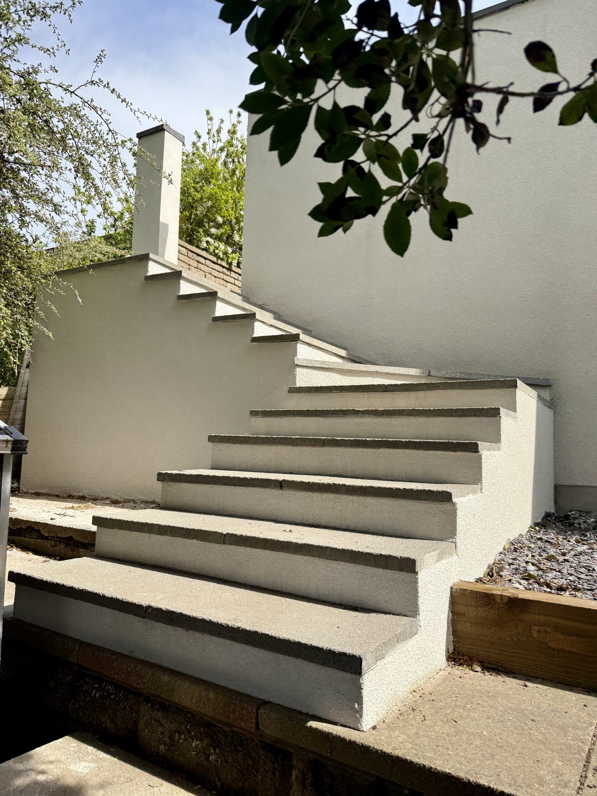 New garden steps and retaining wall rendered in Chalk White silicone render, Portishead